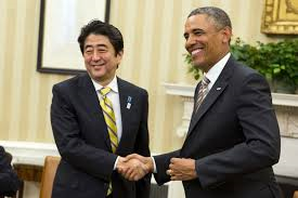 Obama shaking hands with Abe