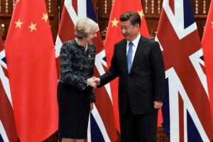 FILE PHOTO: Chinese President Xi Jinping (R) shakes hand with British Prime Minister Theresa May before their meeting at the West Lake State House on the sidelines of the G20 Summit, in Hangzhou, Zhejiang province, China, September 5, 2016. REUTERS/Etienne Oliveau/Pool/File Photo